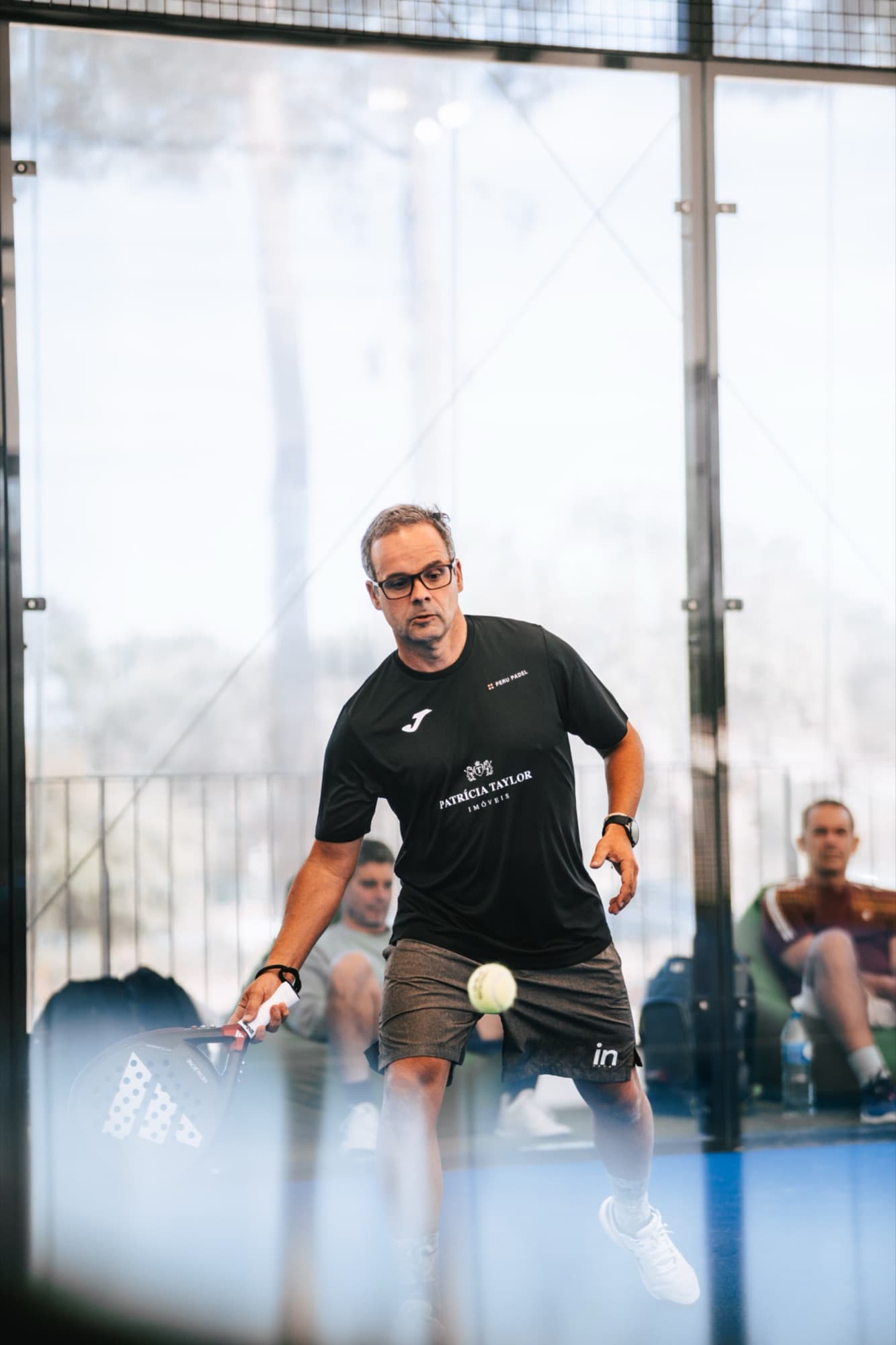 Forehand mid-rally at Peru Padel