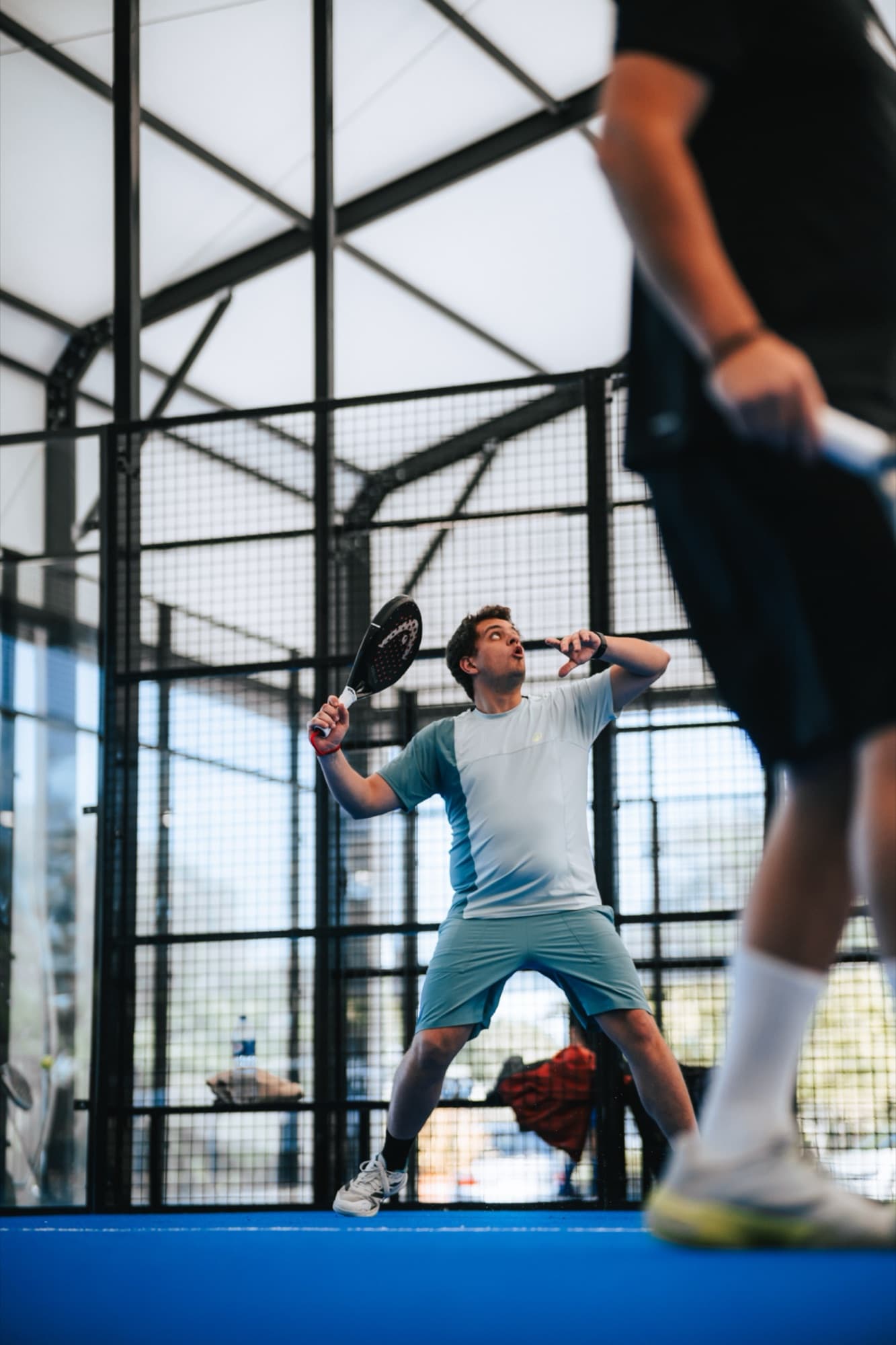 Player on a Peru Padel indoor court