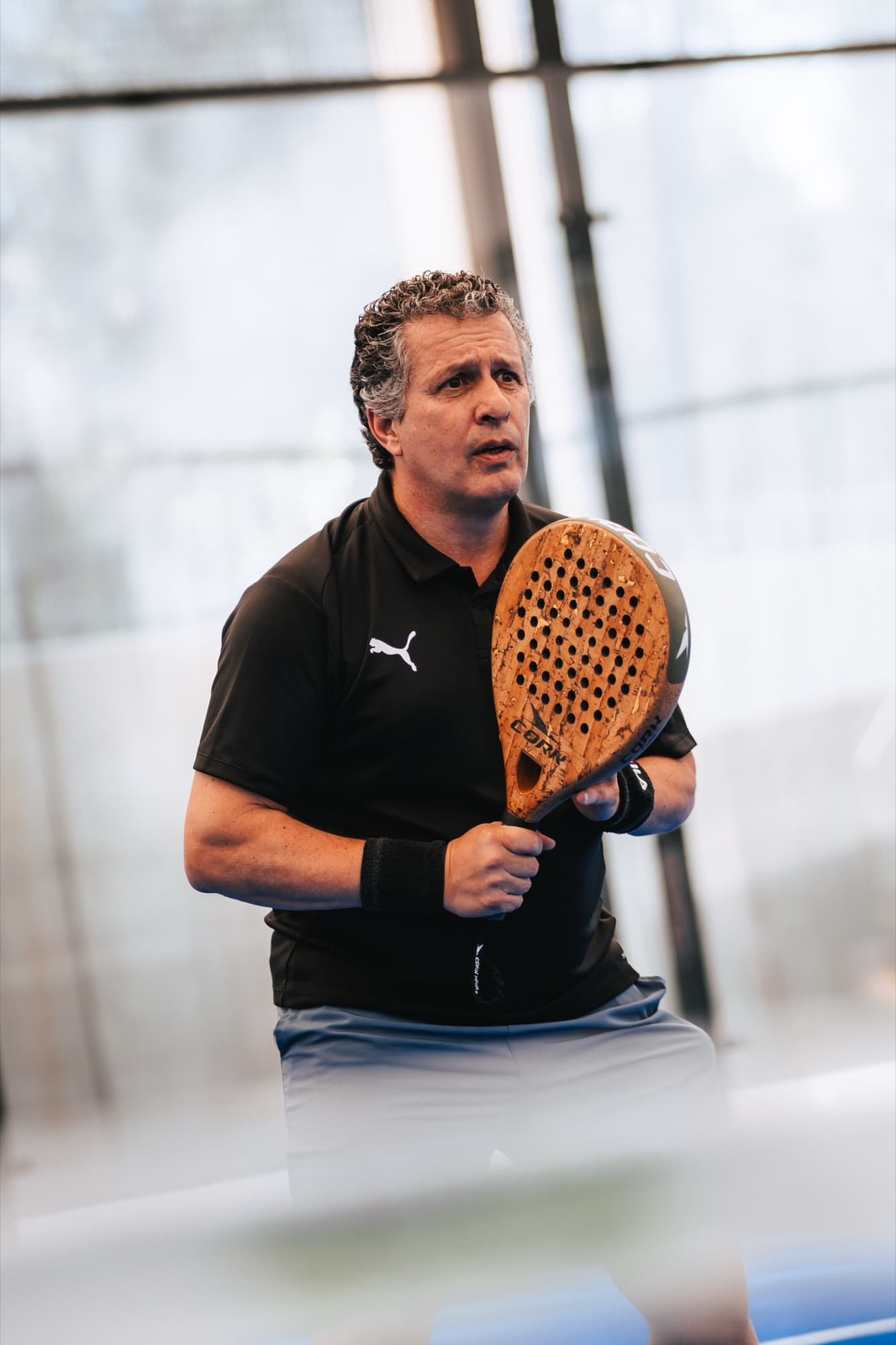 Player ready stance with cork paddle